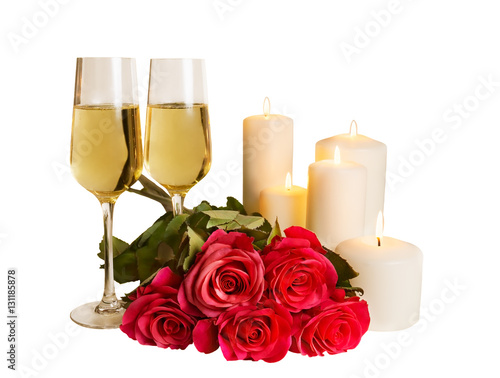 Champagne, roses and candles isolated on white background