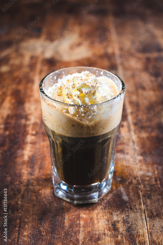 Cup of coffee with ice cream and chocolate on wooden background Cup of coffee with ice cream and chocolate on wooden background