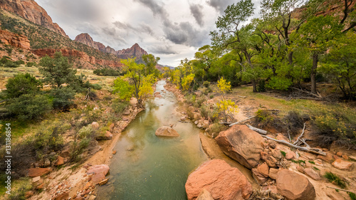 Large stones among water flow. The Virgin River flowing through Zion National Park, Utah, USA