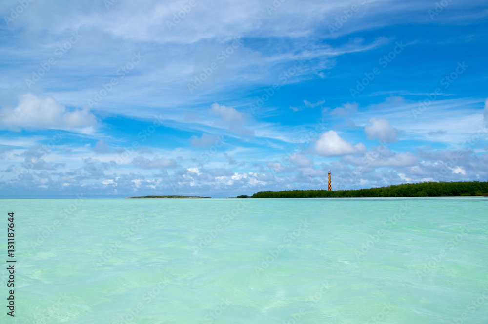 Faro Paredon Lighthouse taken from the shallow sand banks on the island of Cayo Paredon Grande. Jardine Del Rey archipelago in Cuba.
