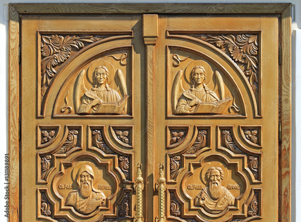 carved well decorated door in orthodox church