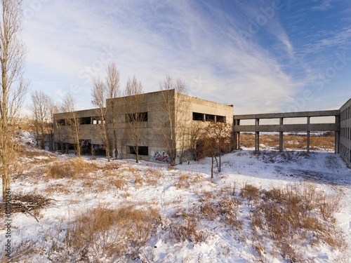 Beautiful old ruined house in winter time. Aerial view.