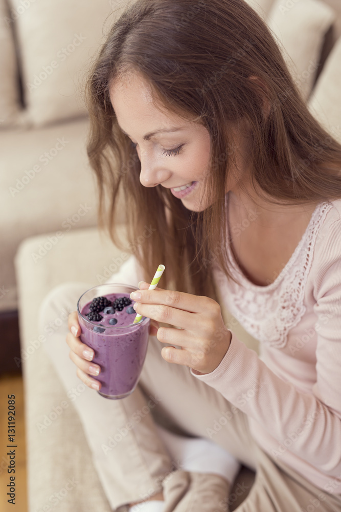 Drinking raspberry smoothie