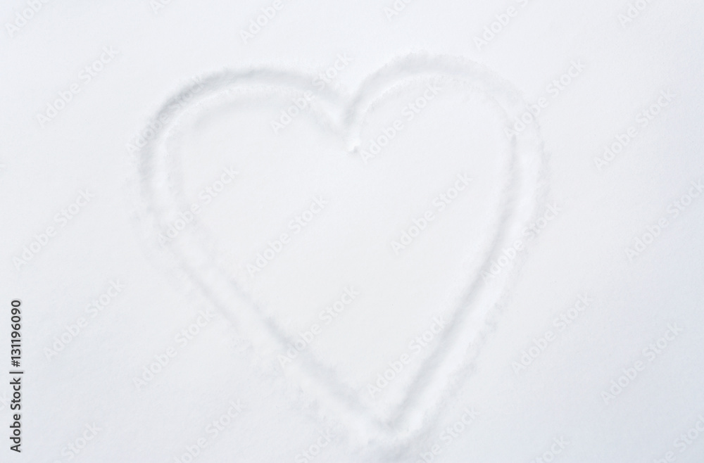 heart shape silhouette or print on snow surface