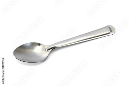 Stainless steel glossy metal kitchen spoon isolated over the white background