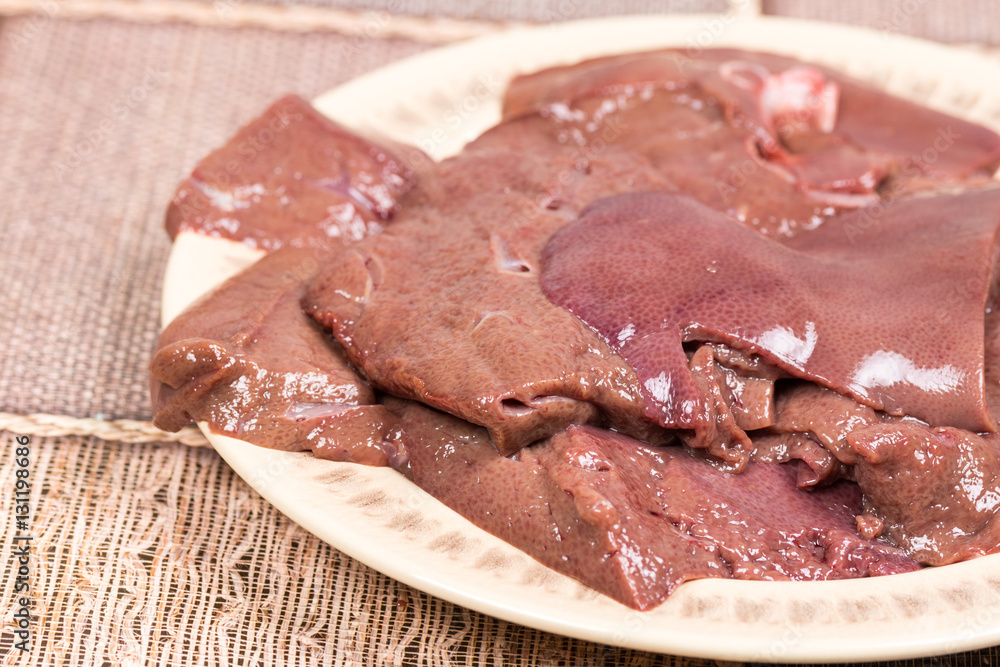 Sliced raw pork liver on the plate