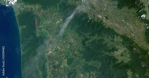 High-altitude overflight aerial of volcanic activity on Sinabung Volcano, Indonesia. Clip loops and is reversible. Elements of this image furnished by USGS/NASA Landsat photo