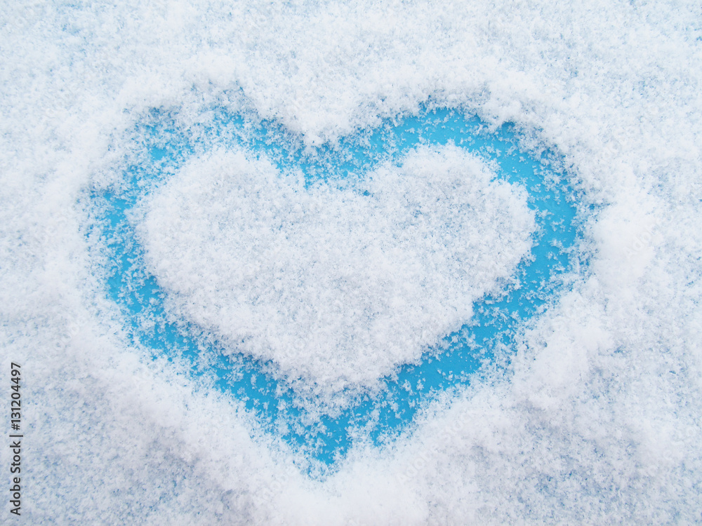Heart from snowflakes on a blue background Heart from snowflakes on a blue background