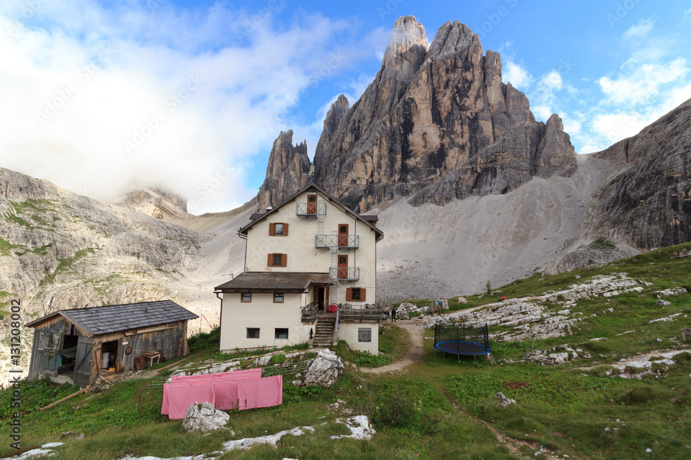 Alpine Hut Zsigmondyhütte and mountain Zwölferkofel in Sexten Dolomites, South Tyrol, Italy