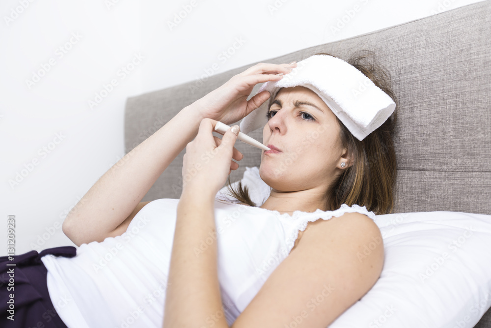 Young sleeping woman in bedroom at home wearing in white Young sleeping woman in bedroom at home wearing in white