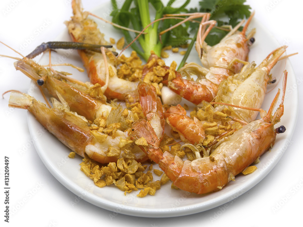 Prawn lobster or shrimp fried with garlic and vegetables. Prawn lobster or shrimp fried with garlic and vegetables.