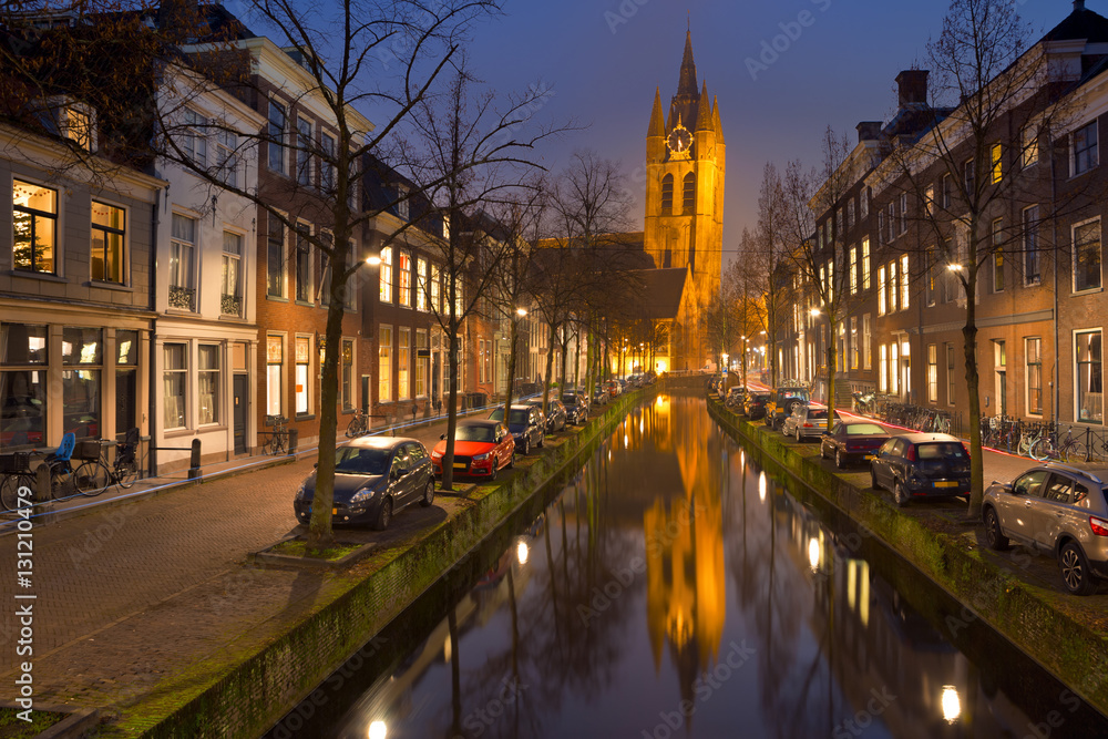 Church reflected in a canal in Delft, The Netherlands