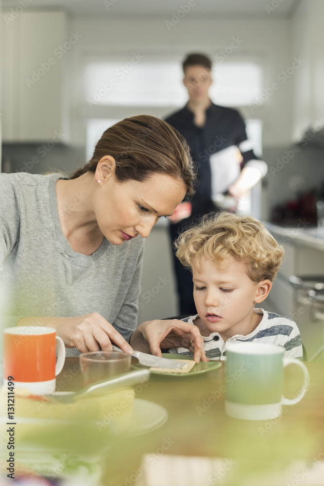 Woman making breakfast in living room at home Woman making breakfast in living room at home