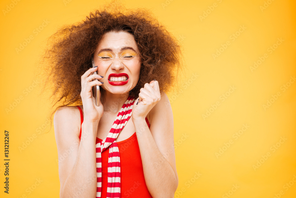 Shocked Bright model talking at phone with closed eyes Shocked Bright model talking at phone with closed eyes