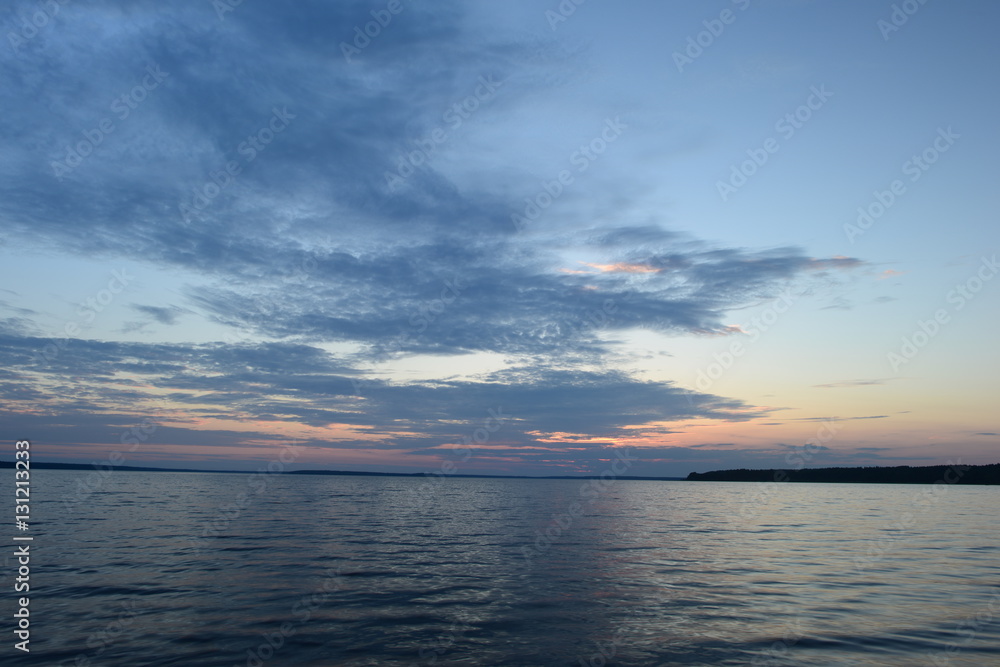 Leading lines at sunset on the water surface to infinity