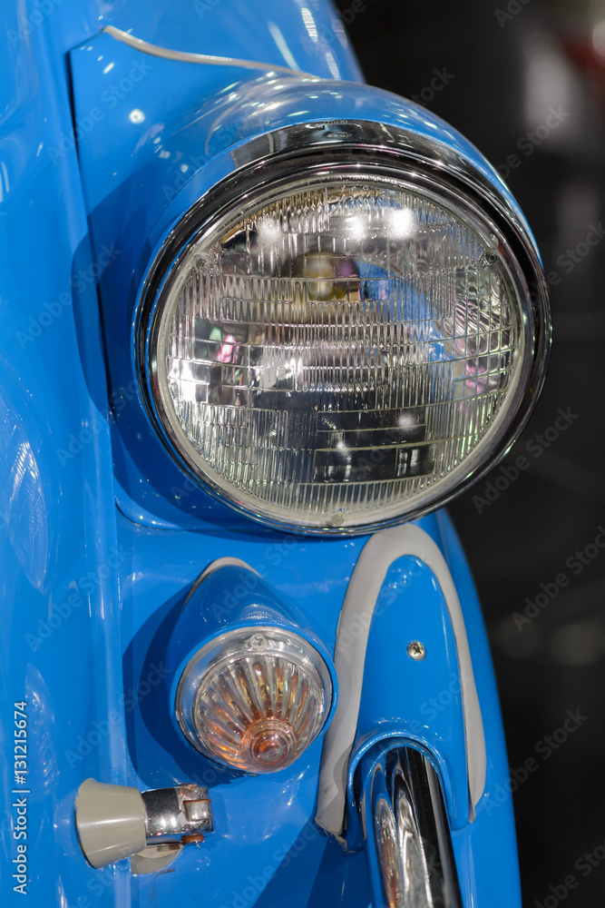 Closeup of light on blue car. Beautiful modern blue car headligh