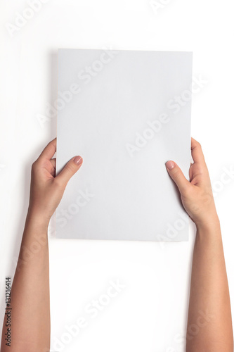 Hand holding white blank paper sheet mockup, isolated. Arm hold clear brochure template mock up. Simple pure print display show.