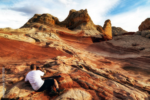 Photographer photographing White Pocket rock formation, Page, Arizona, USA photo