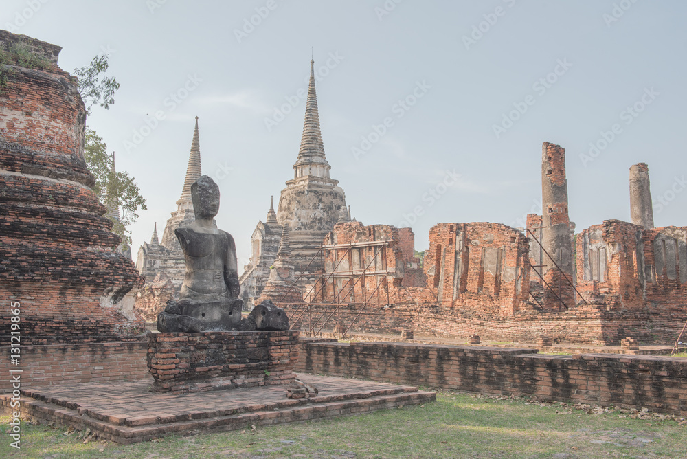 Old damage Buddhist at Wat Phra Sri Sanphet national historic site with lights show at twilight time in Ayutthaya, Thailand. Old damage Buddhist at Wat Phra Sri Sanphet national historic site with lights show at twilight time in Ayutthaya, Thailand.