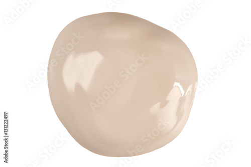 Round face make-up liquid foundation sample on a white background