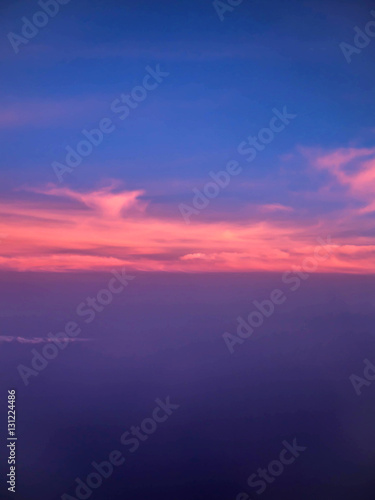 ariel view of clouds and sky in sunset above city