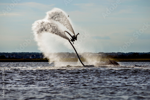 Person flyboarding in ocean, Seaside Heights, New Jersey, USA photo