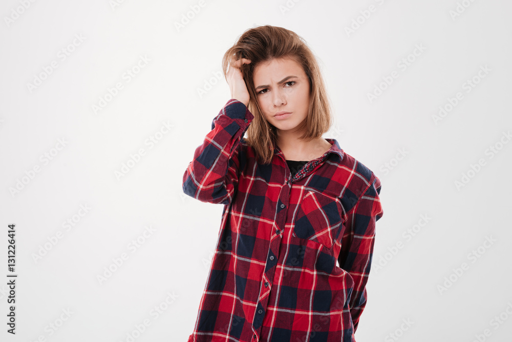 Girl in plaid shirt looking at camera isolated Girl in plaid shirt looking at camera isolated