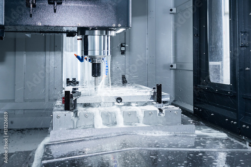 High precision CNC machining center working, operator machining
