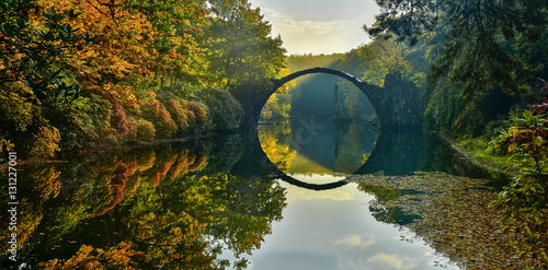 Amazing place in Germany - Rakotzbrucke also known as Devils Bridge in Kromlau. photo