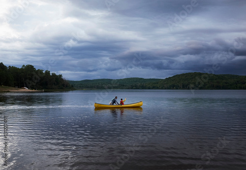 Father and son canoeing on lake, Arrowhead Provincial Park, Ontario, Canada