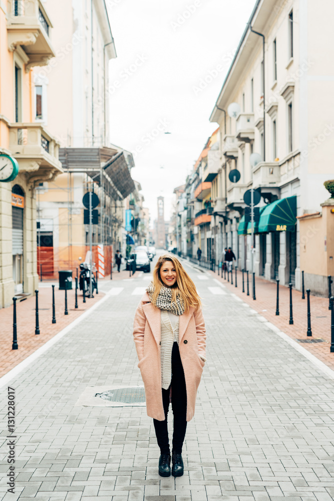 Young beautiful caucasian blonde hair woman posing outdoor in the city, smiling - happiness, confident, having fun concept