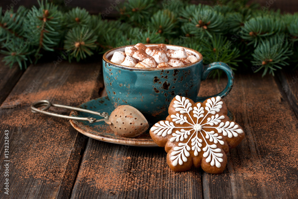 Cup of hot chocolate with marshmallows and gingerbread cookies on a wooden table Cup of hot chocolate with marshmallows and gingerbread cookies on a wooden table