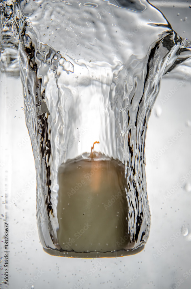Lit Candle dropped into water Mild Edit and NR Stock Photo Adobe Stock