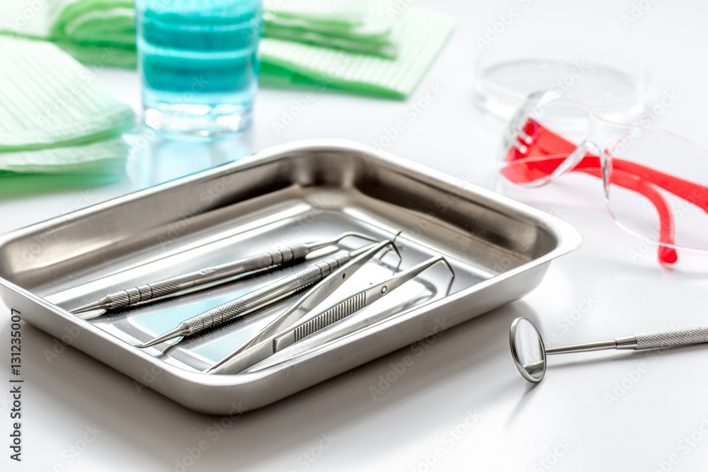 dentists tools in cabinet on white desktop dentists tools in cabinet on white desktop