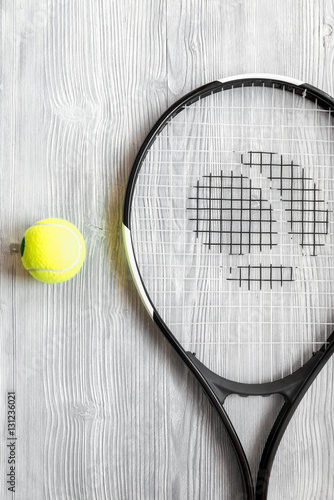 tennis racket on wooden background top view © 279photo