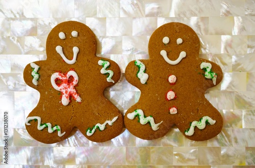 Two gingerbread men cookies decorated for Christmas