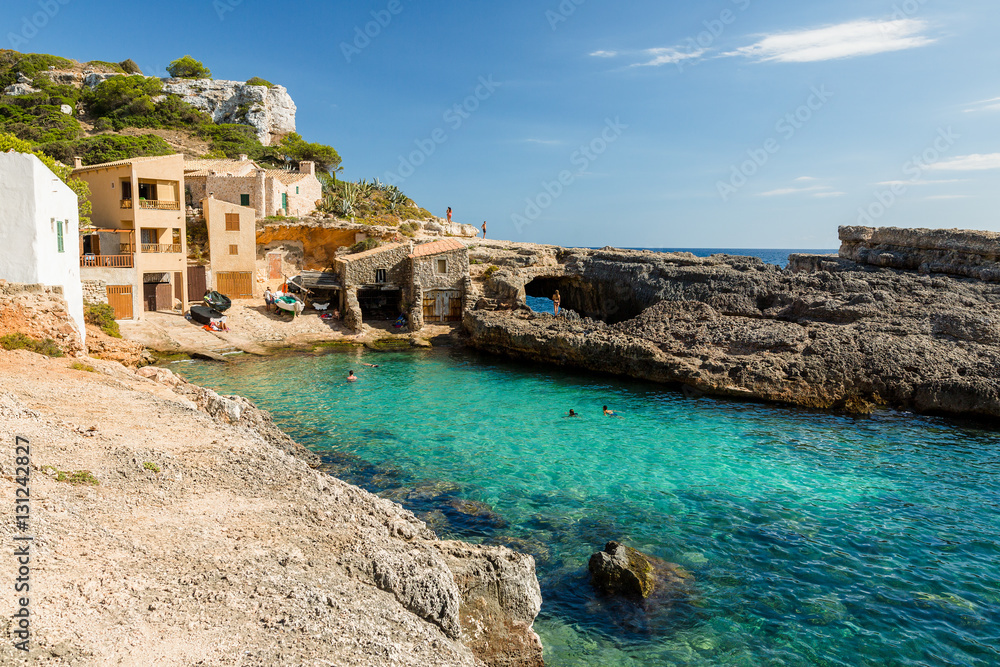 Cala s'Almonia, beach with small fishermen houses. Mallorca. Spain.