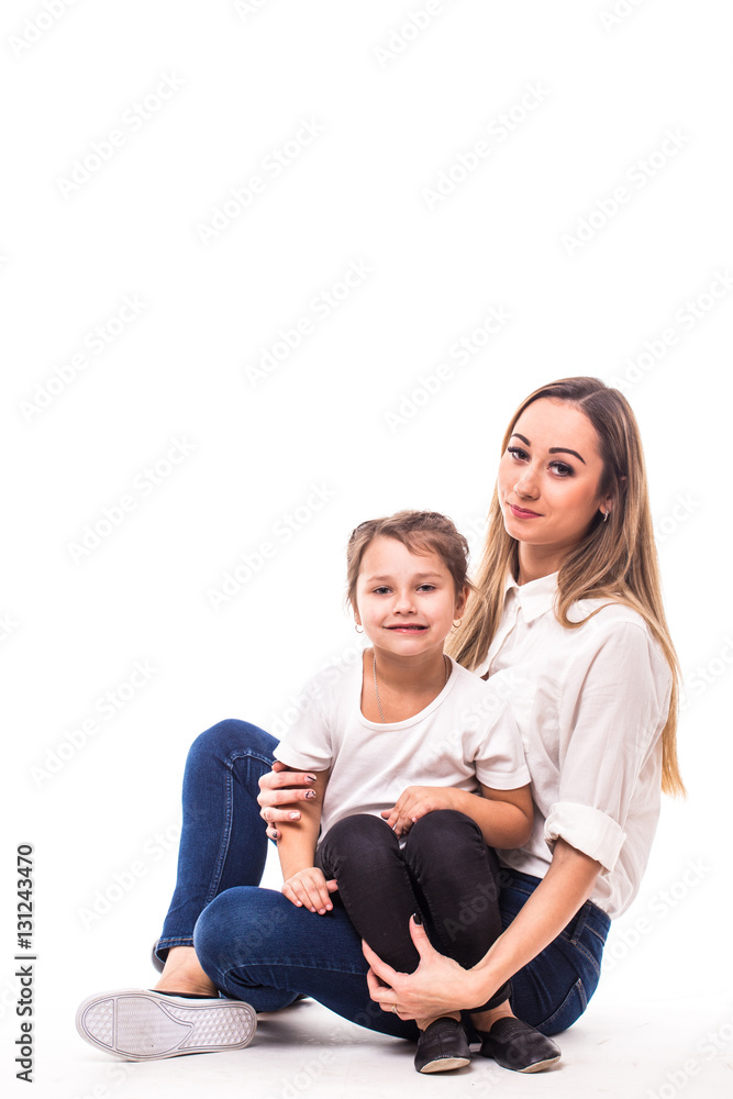 Happy family on white background. Mother and small daughter Happy family on white background. Mother and small daughter