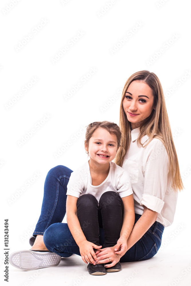 Happy family on white background. Mother and small daughter Happy family on white background. Mother and small daughter