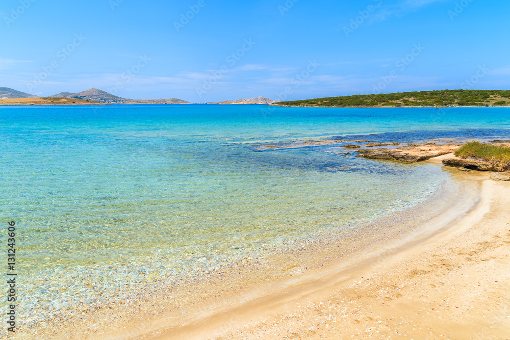 View of beautiful sandy beach with azure sea water on coast of Paros island, Greece