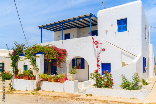 White typical Greek house on street of Naoussa town, Paros island, Greece