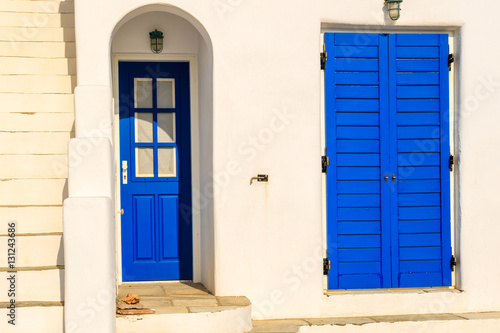 Blue door of typical Greek house on coast of Paros island, Greece