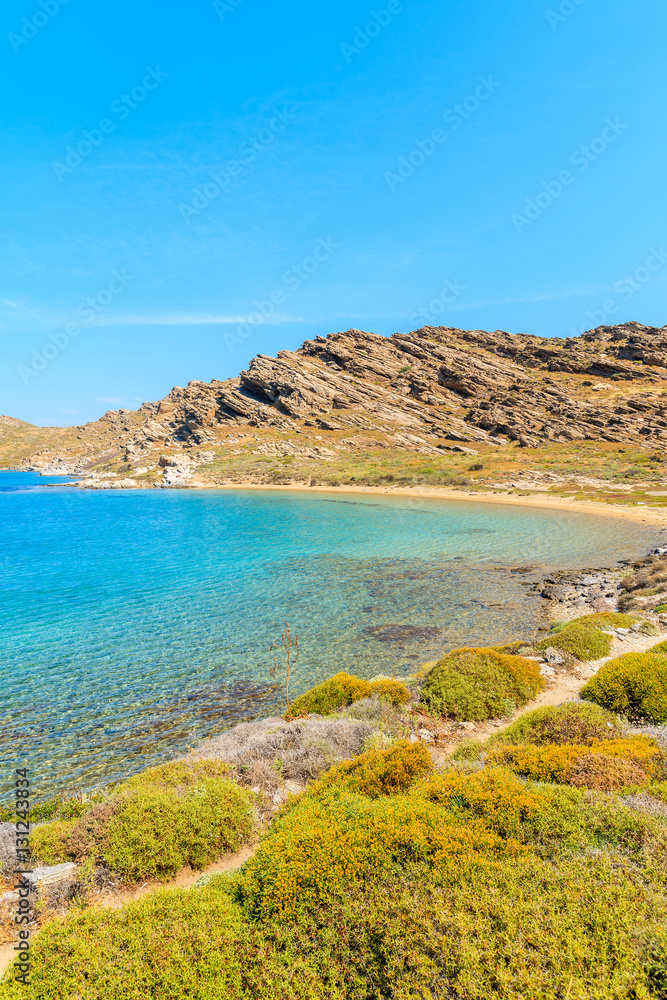 Beautiful coastal path along crystal clear sea water in Monastiri bay on Paros island, Greece