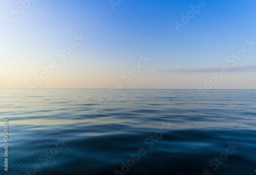 View of horizon line with summer sky and blue ocean © Aleksei