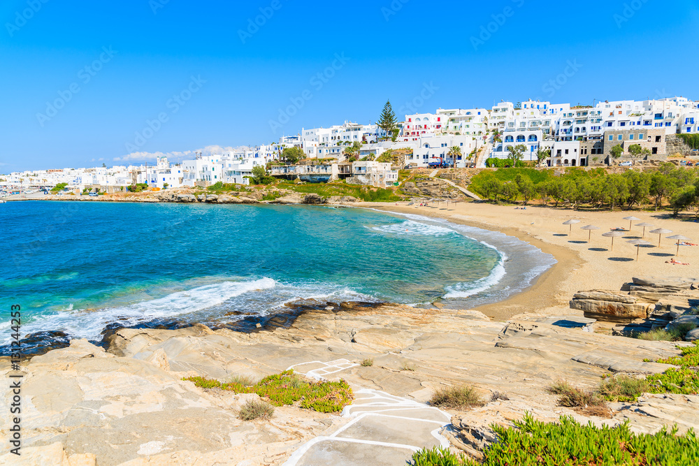 Path to beautiful sea bay with beach in Naoussa town, Paros island, Greece