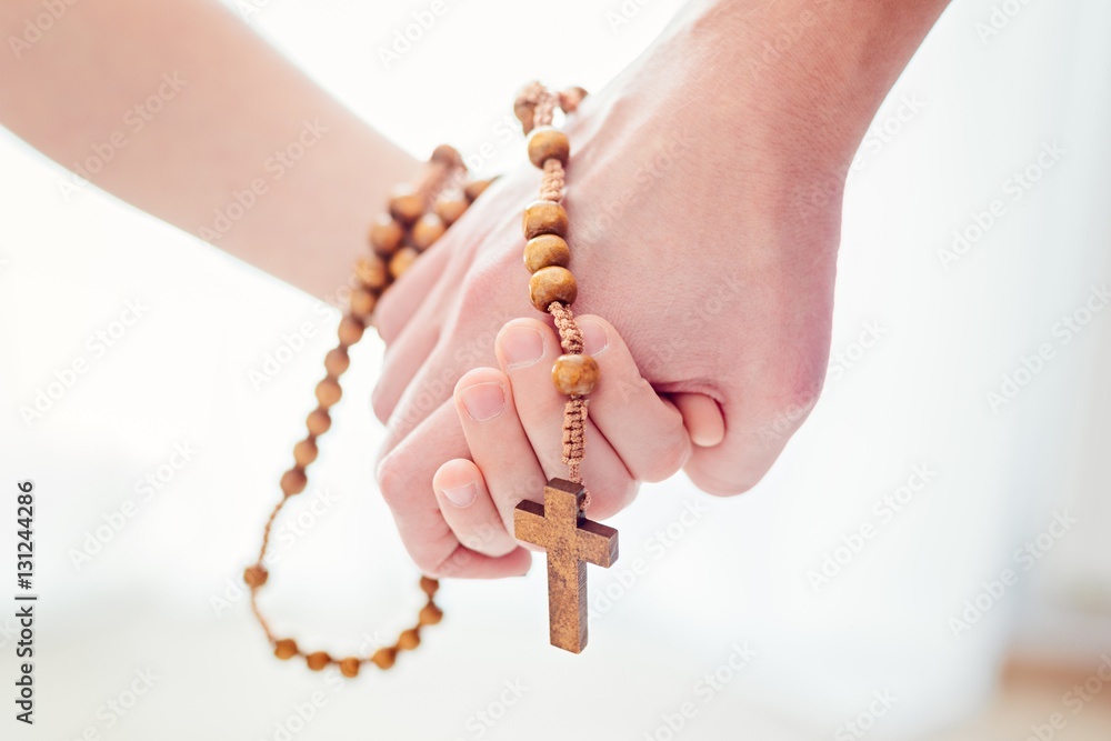 Mother and father praying together Stock Photo | Adobe Stock