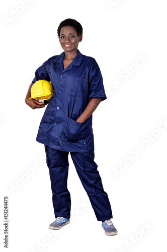 Young smiling construction worker holding his helmet on a white background