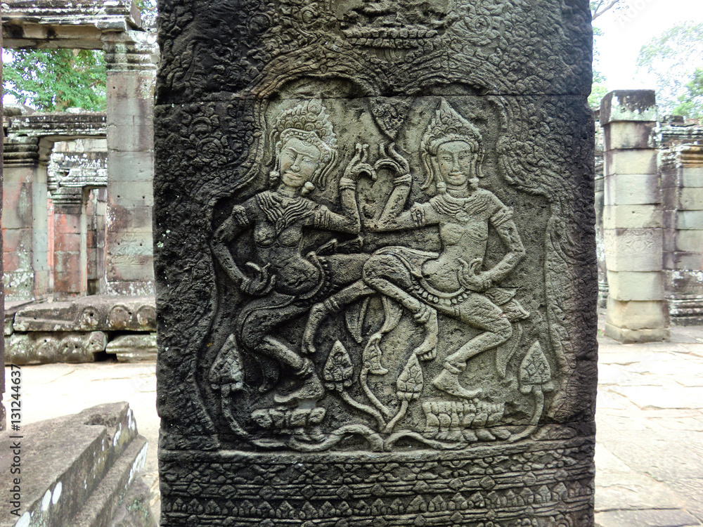 Ancient stone carving figures cut in Siem Reap Cambodia temple
