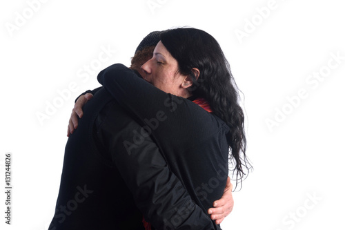 Couple embracing on white background