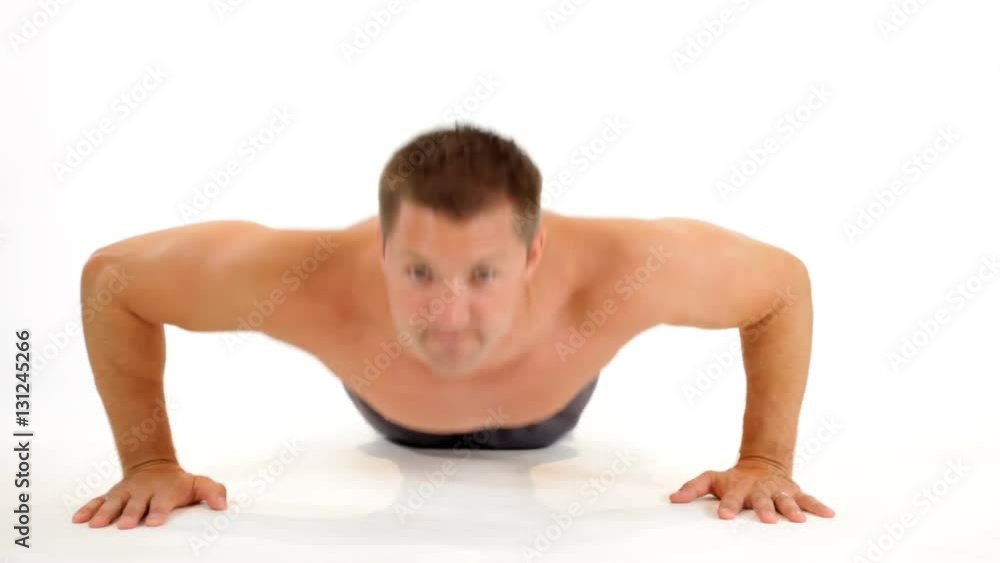 A young muscular man doing push-ups 